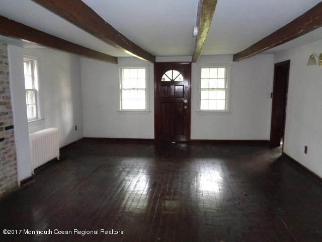 90 Jackson Mills Road Freehold, NJ 07728 - Photo 7 of 18 a view of empty room with wooden floor and fan