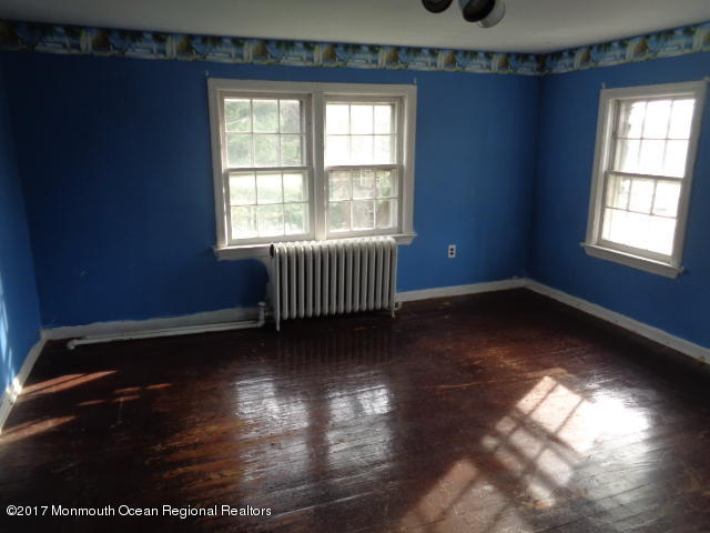 90 Jackson Mills Road Freehold, NJ 07728 - Photo 9 of 18 a view of empty room with wooden floor and fan