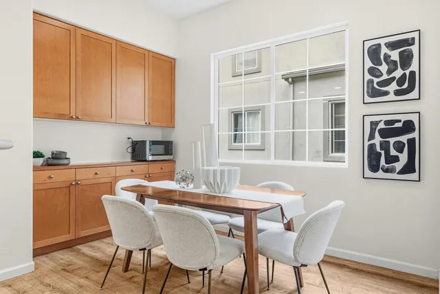 a dining room with furniture and window