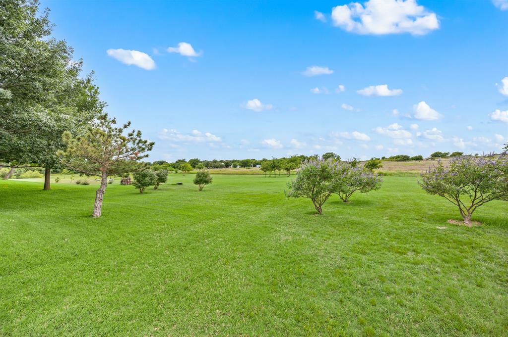 2141 Old Denton Road Decatur, TX 76234 - Photo 37 of 40 Expansive green lawn with scattered trees