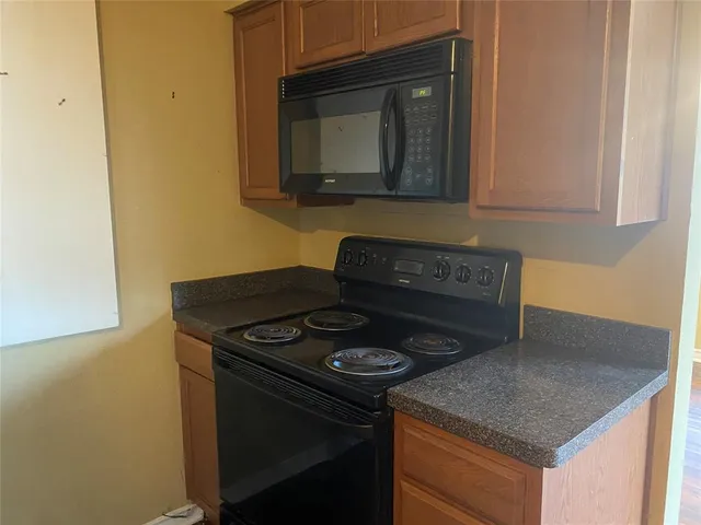 a kitchen with a stove and a microwave