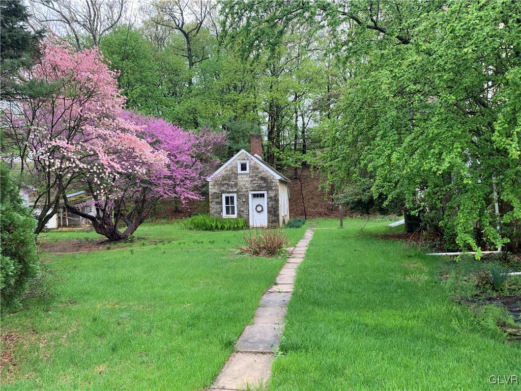 4848 Huckleberry Road Orefield, PA 18069 - Photo 3 of 3 a front view of a house with garden