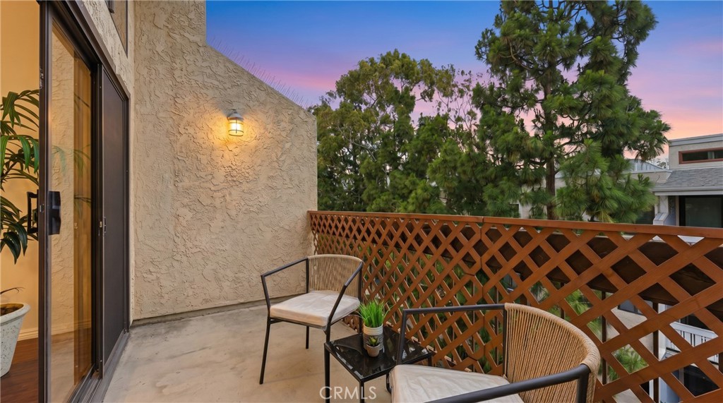 8180 Manitoba Street, Unit 330 Playa del Rey, CA 90293 - Photo 4 of 31 a balcony with table and chairs
