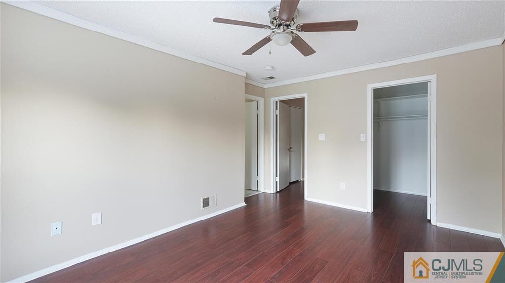 201 Nebula Road Piscataway, NJ 08854 - Photo 19 of 27 an empty room with wooden floor and ceiling fan