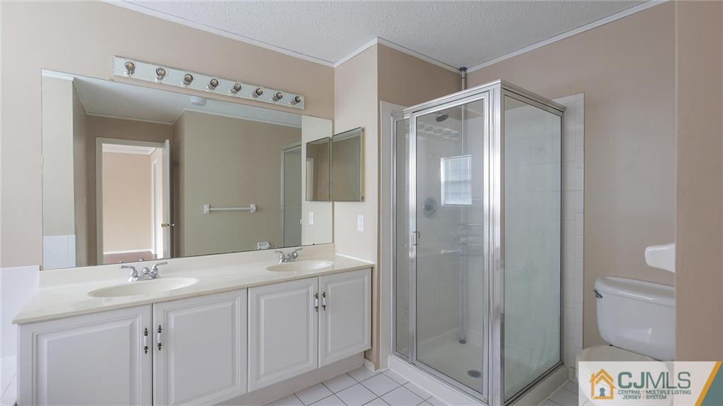 201 Nebula Road Piscataway, NJ 08854 - Photo 20 of 27 a bathroom with a double vanity sink mirror and shower