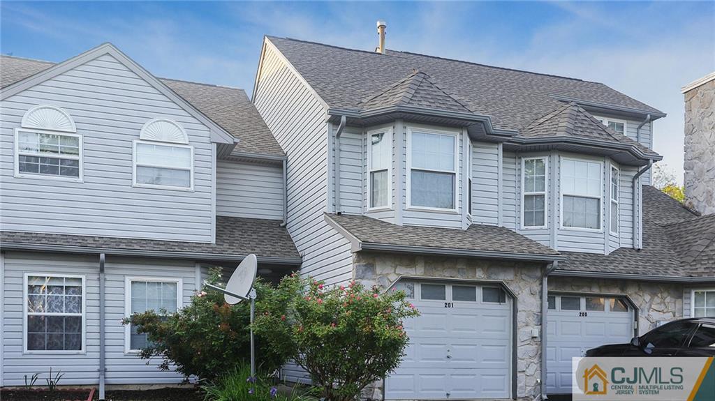 201 Nebula Road Piscataway, NJ 08854 - Photo 2 of 27 a front view of a house with a garden