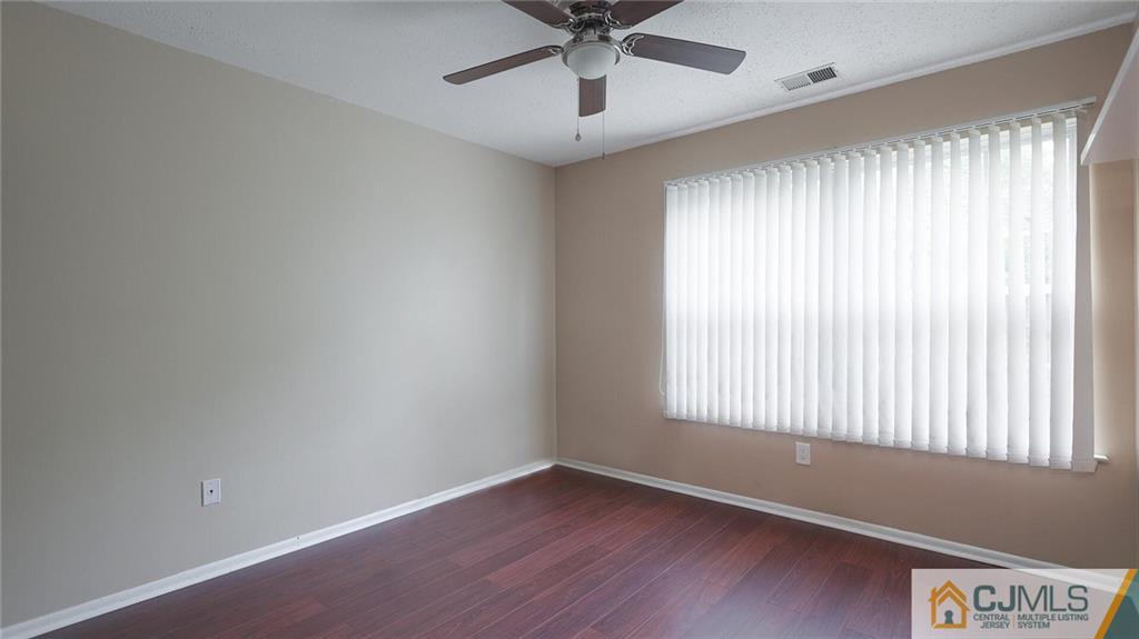 201 Nebula Road Piscataway, NJ 08854 - Photo 22 of 27 a view of an empty room with a window and wooden floor