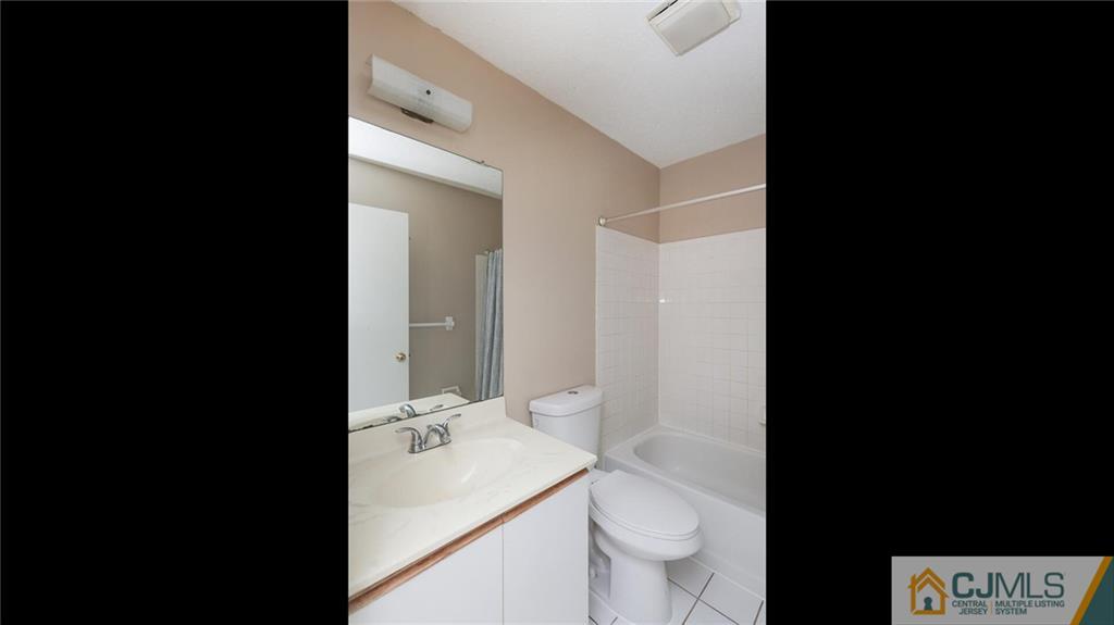 201 Nebula Road Piscataway, NJ 08854 - Photo 23 of 27 a bathroom with a sink and a toilet
