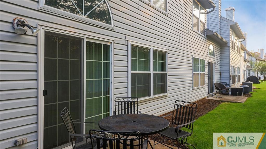 201 Nebula Road Piscataway, NJ 08854 - Photo 25 of 27 a view of a backyard with a table and chair