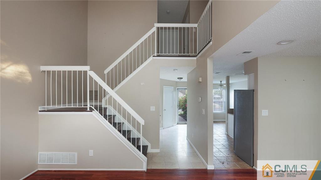 201 Nebula Road Piscataway, NJ 08854 - Photo 6 of 27 a view of entryway with wooden floor