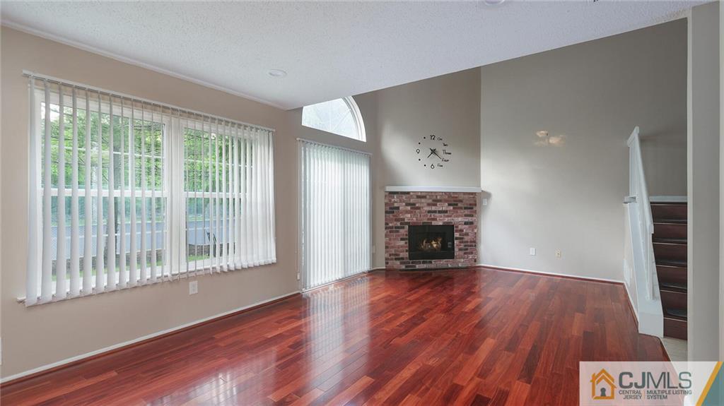 201 Nebula Road Piscataway, NJ 08854 - Photo 10 of 27 a view of an empty room with wooden floor and a window