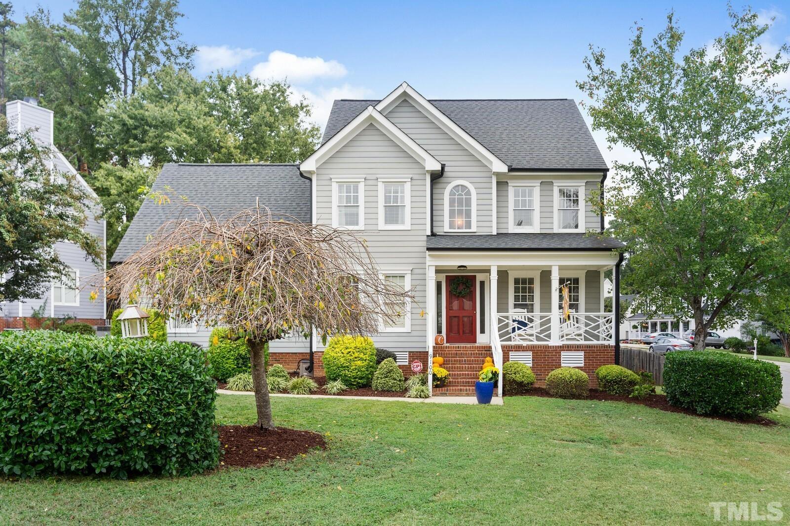 9100 Dawnshire Road Raleigh, NC 27615 - Photo 1 of 30 a front view of a house with a yard and trees