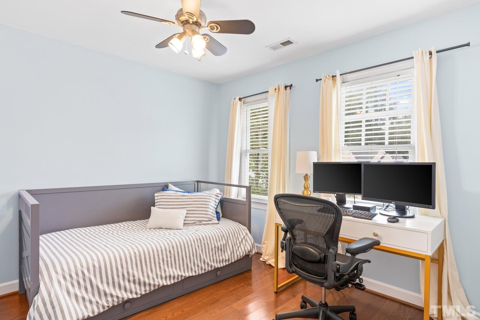 9100 Dawnshire Road Raleigh, NC 27615 - Photo 16 of 30 a bedroom with a workspace