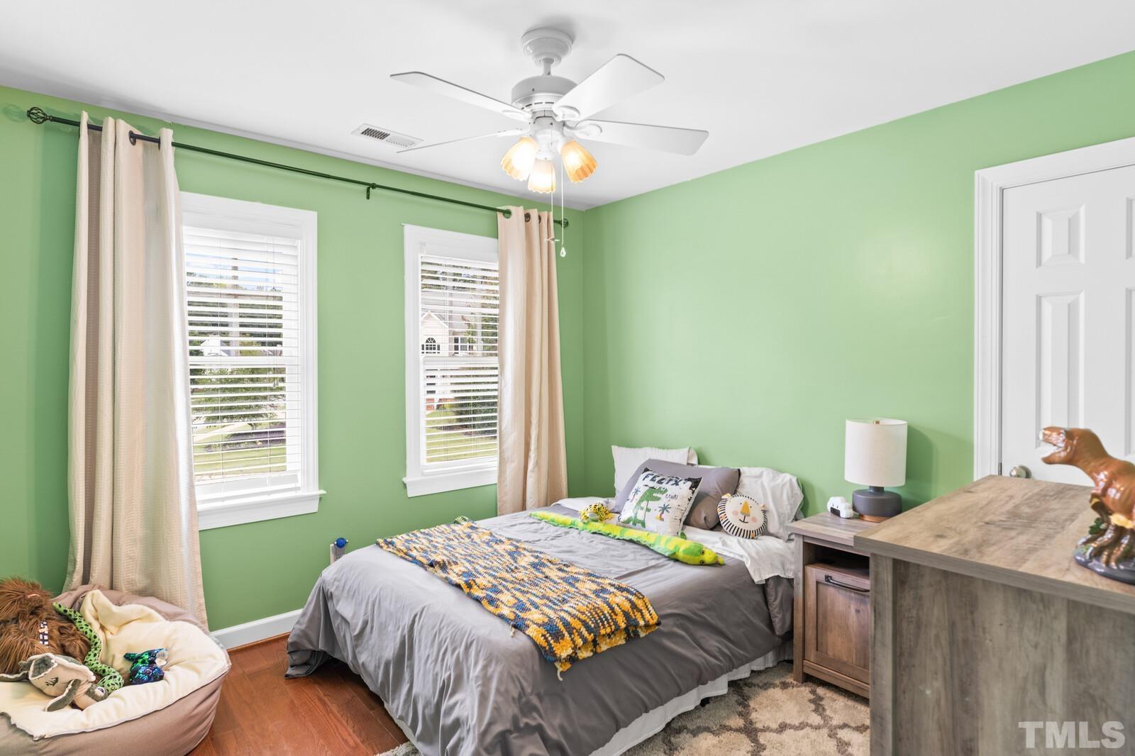9100 Dawnshire Road Raleigh, NC 27615 - Photo 17 of 30 a bedroom with a bed and window