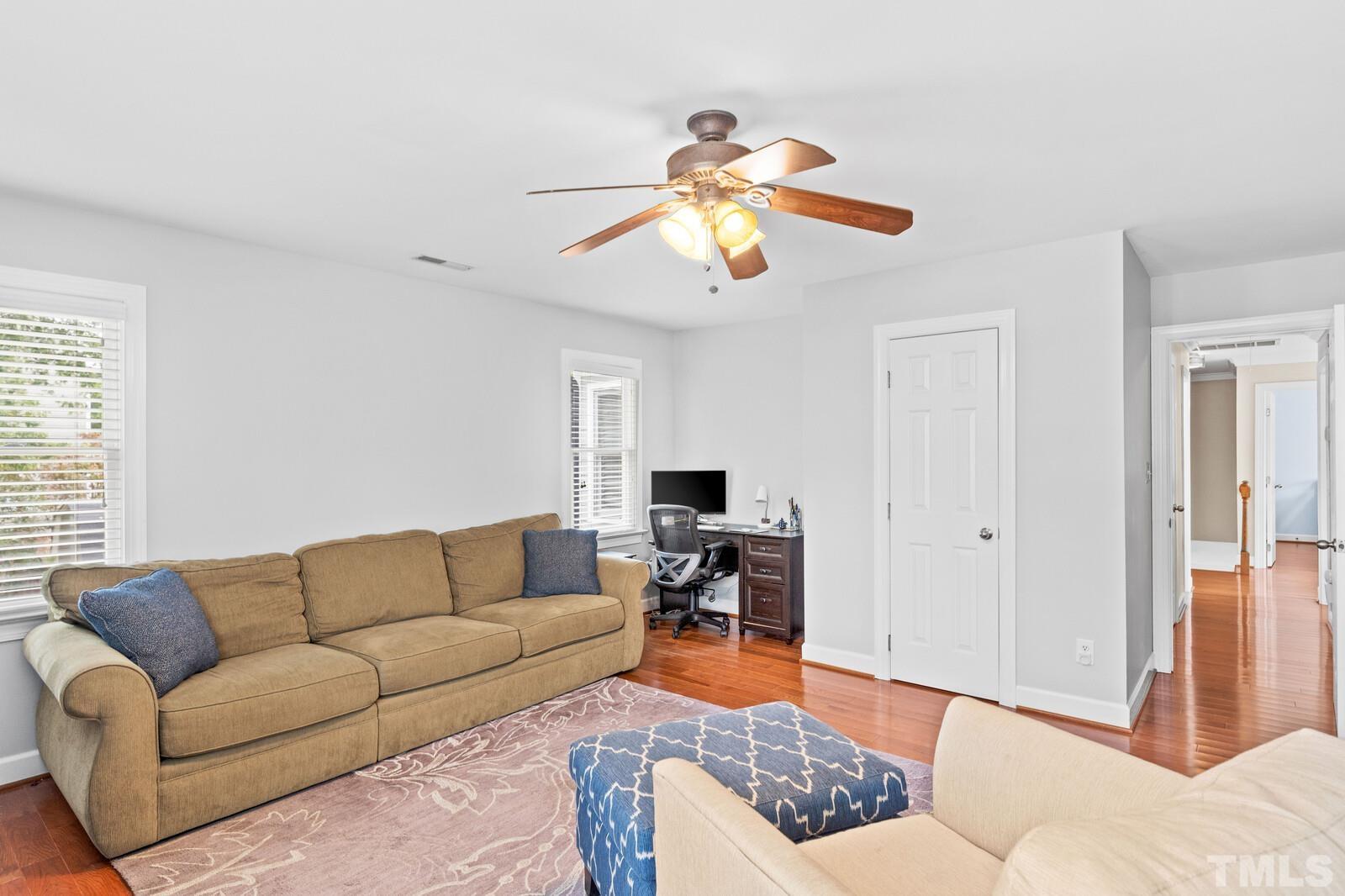 9100 Dawnshire Road Raleigh, NC 27615 - Photo 19 of 30 a living room with furniture and wooden floor