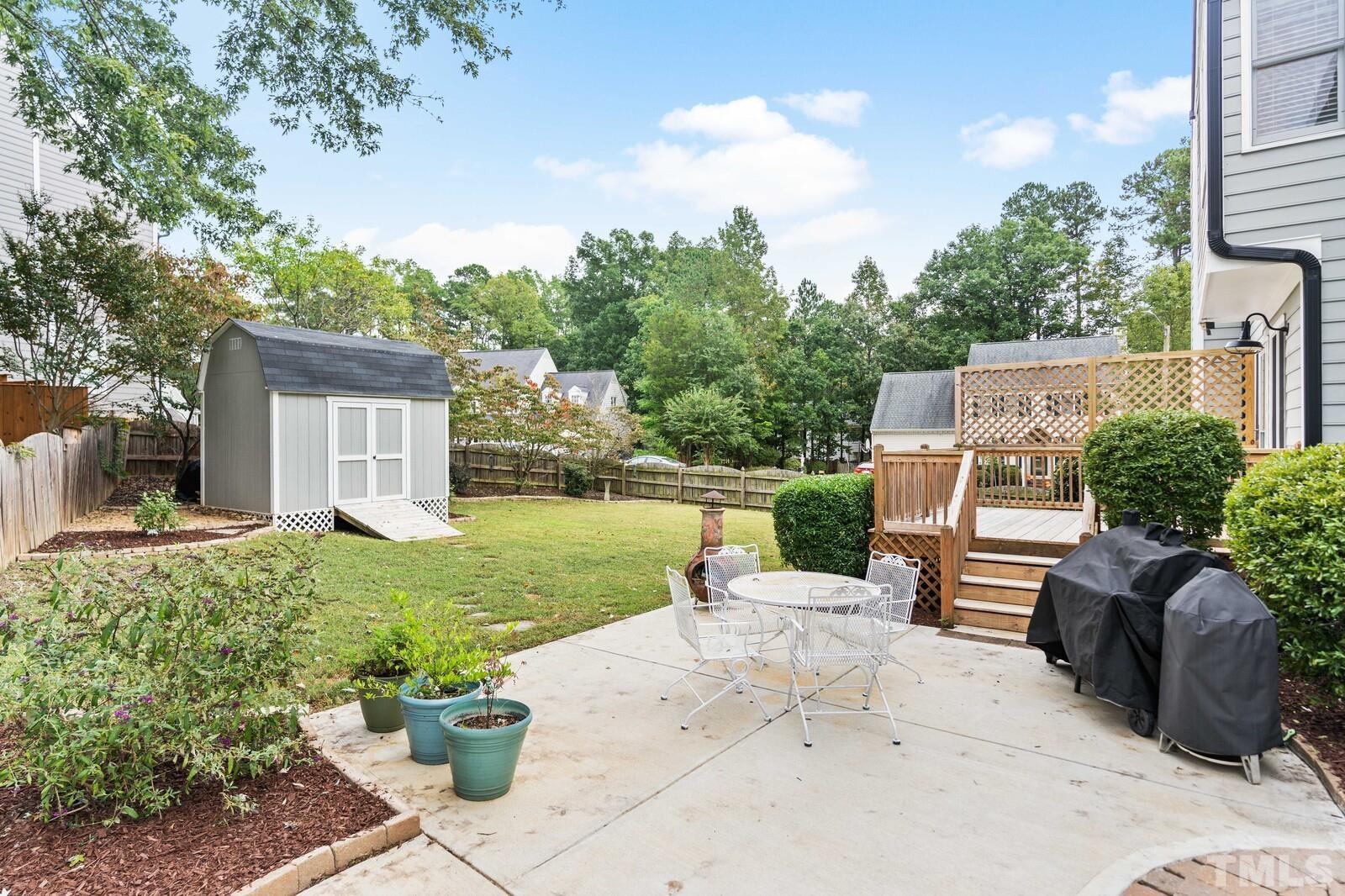 9100 Dawnshire Road Raleigh, NC 27615 - Photo 24 of 30 a view of a backyard with sitting area