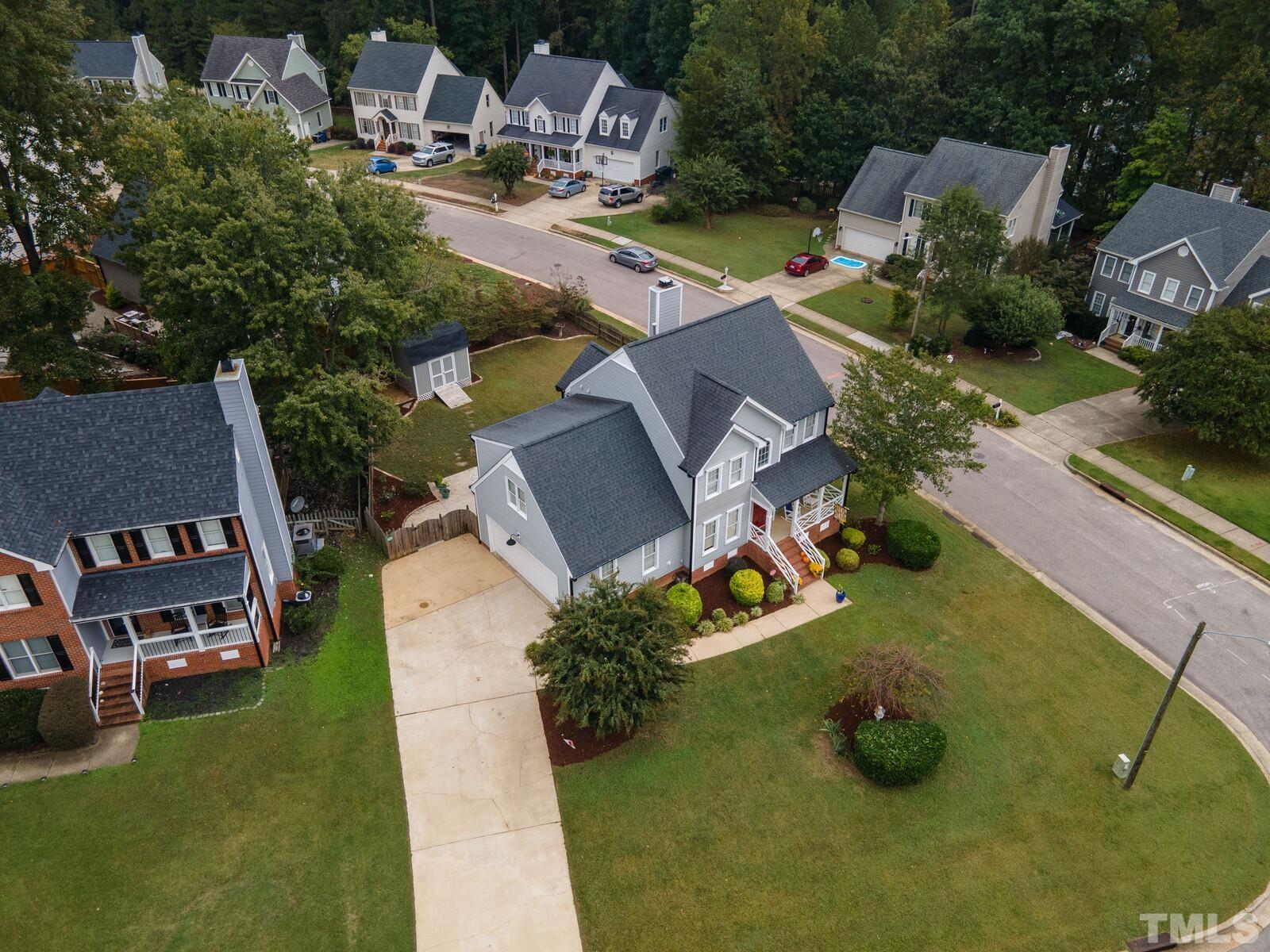 9100 Dawnshire Road Raleigh, NC 27615 - Photo 28 of 30 an aerial view of a house with garden space and street view