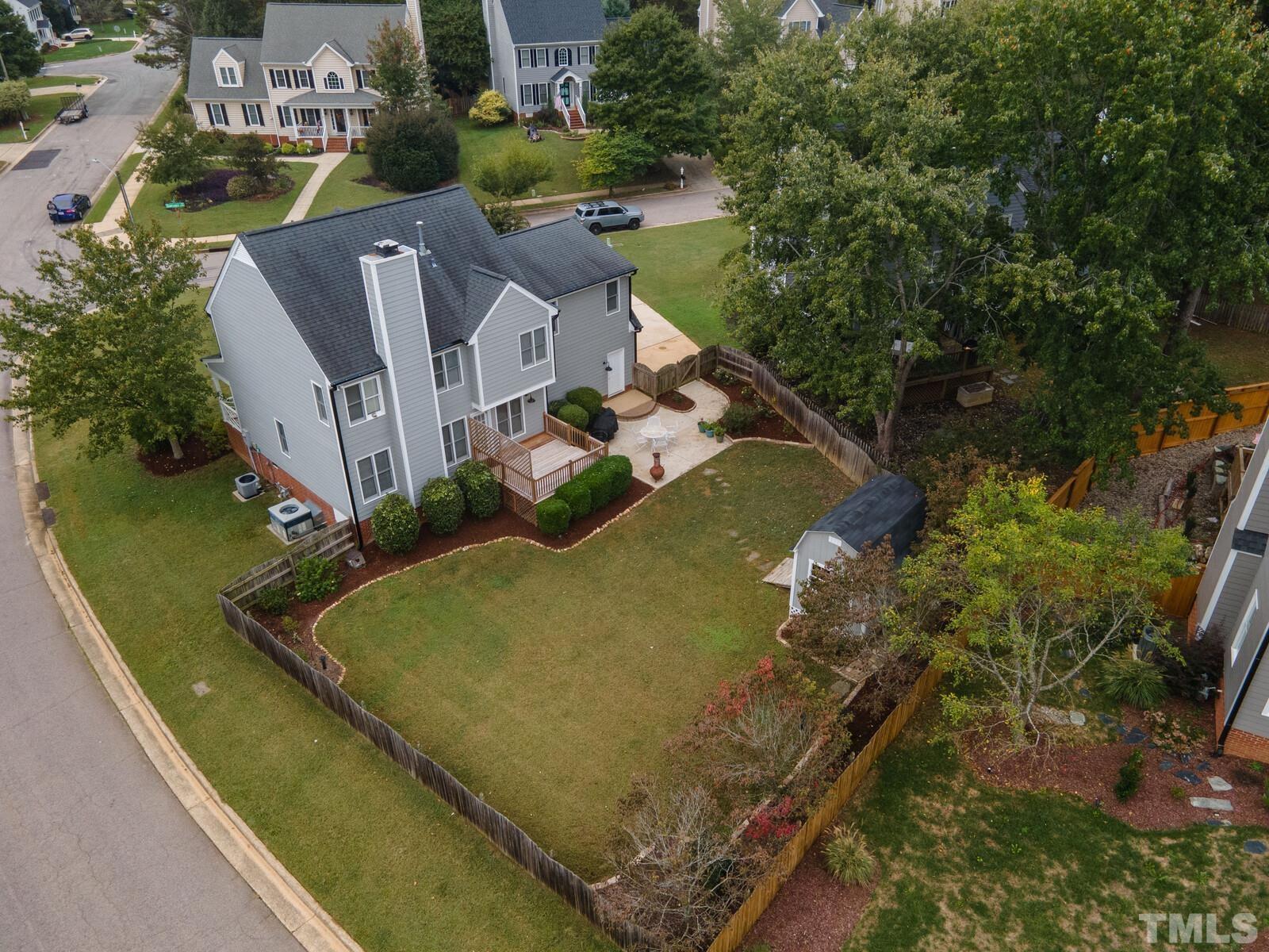 9100 Dawnshire Road Raleigh, NC 27615 - Photo 29 of 30 a view of a house with a yard and sitting area