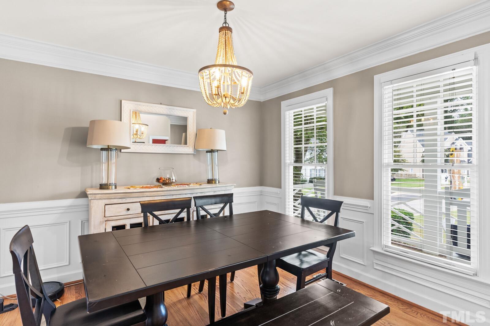 9100 Dawnshire Road Raleigh, NC 27615 - Photo 5 of 30 a view of a dining room with furniture window and wooden floor