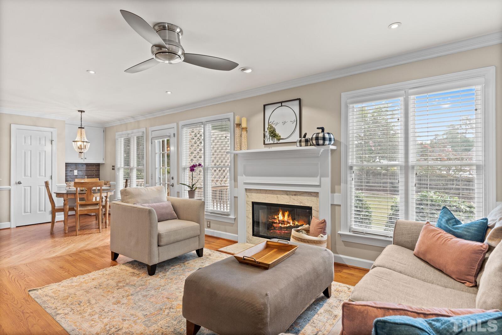 9100 Dawnshire Road Raleigh, NC 27615 - Photo 7 of 30 a living room with furniture fireplace and a large window