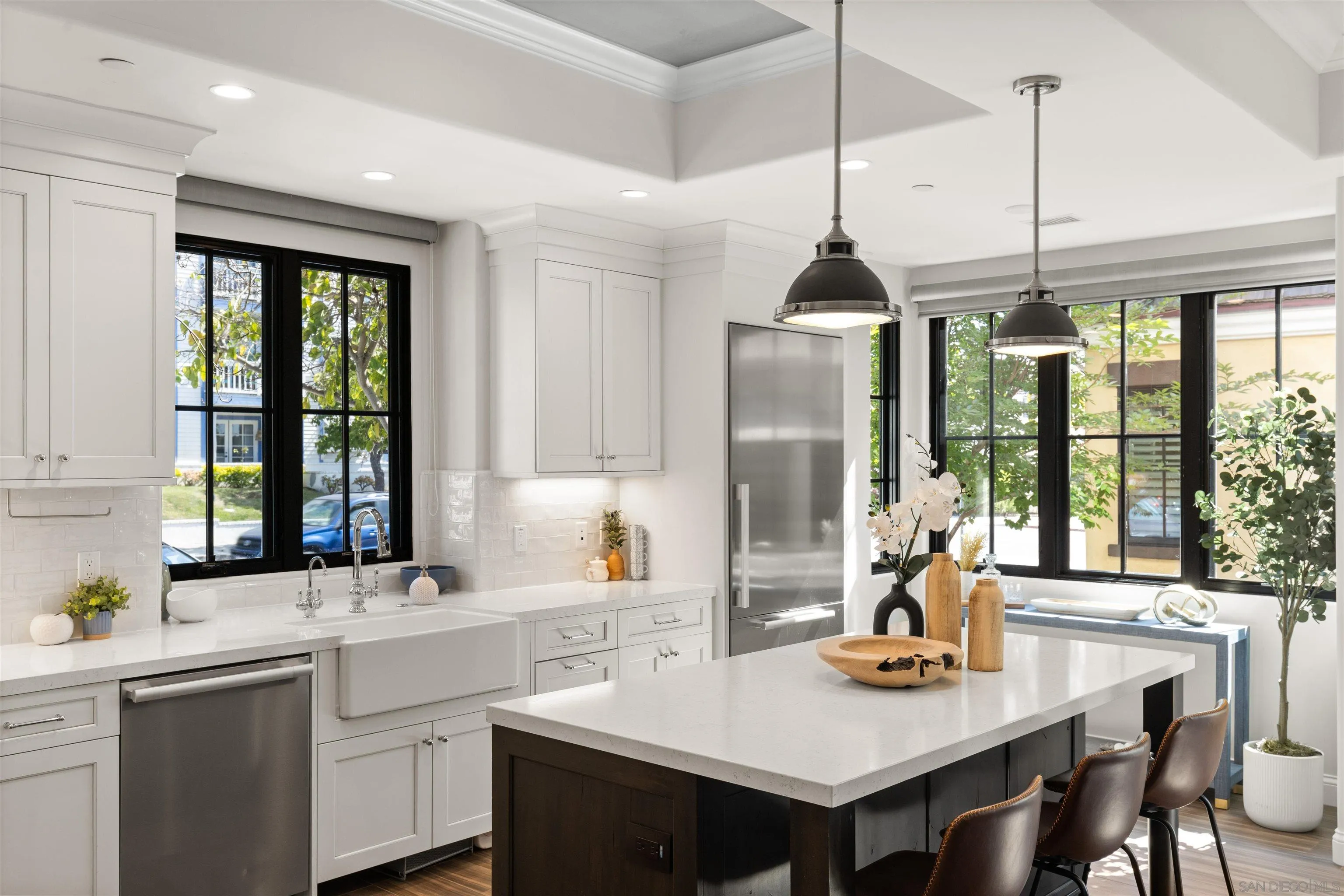708 Silver Street La Jolla, CA 92037 - Photo 13 of 44 a kitchen with a sink a stove and a chandelier