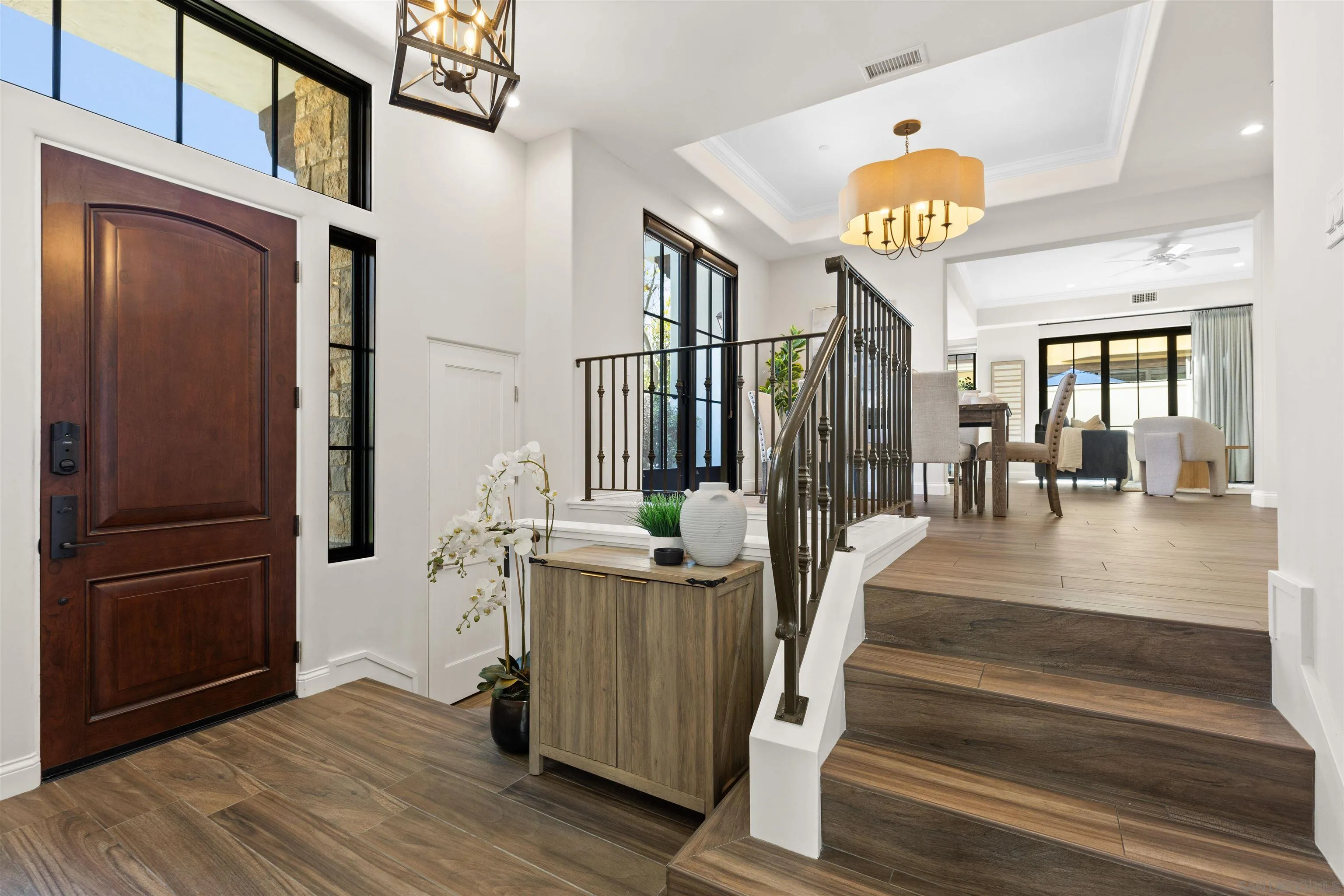 708 Silver Street La Jolla, CA 92037 - Photo 19 of 44 a view of a hallway with wooden floor and staircase