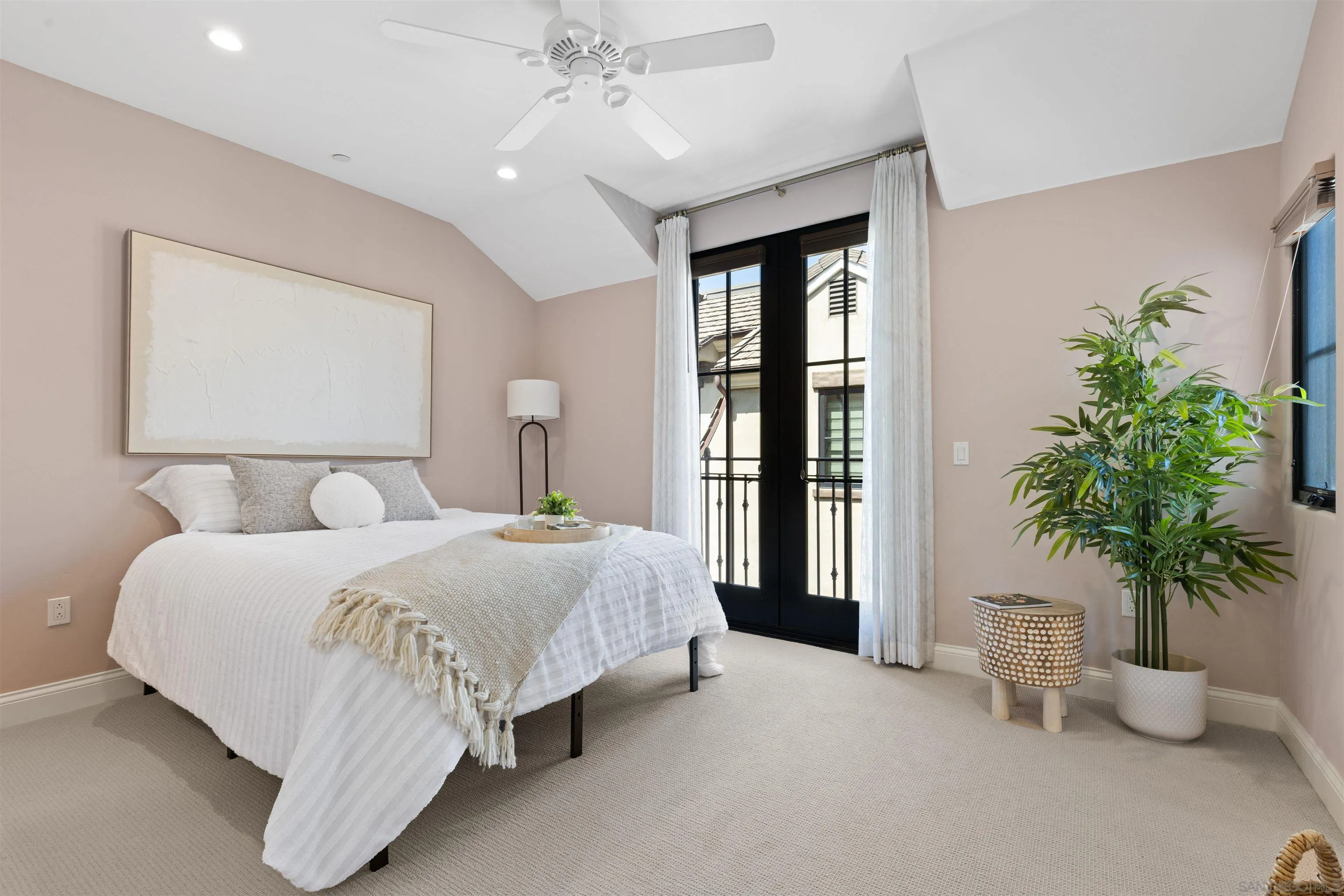 708 Silver Street La Jolla, CA 92037 - Photo 32 of 44 a bedroom with a large bed and a potted plant