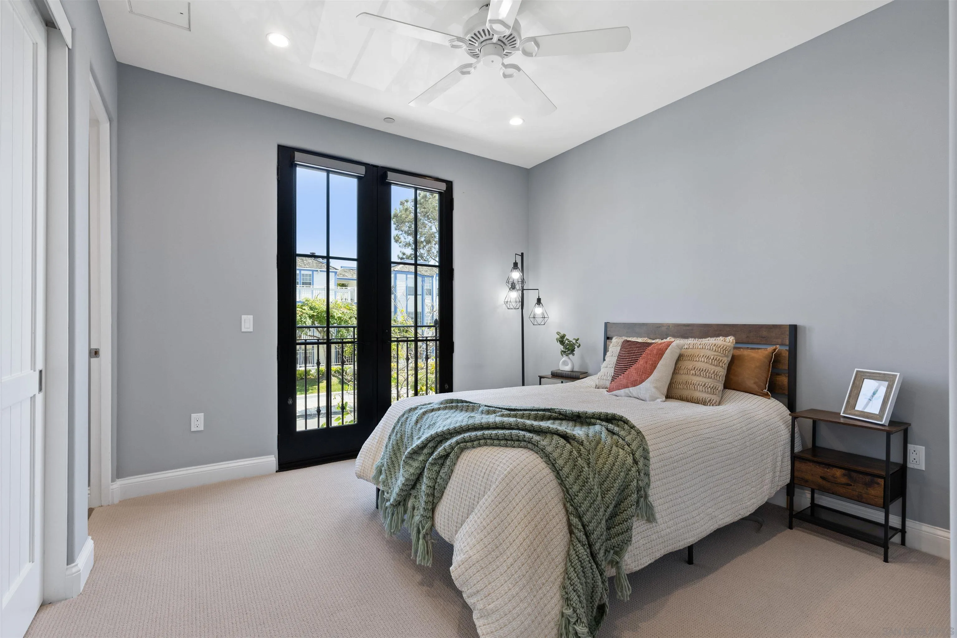 708 Silver Street La Jolla, CA 92037 - Photo 34 of 44 a bedroom with a bed and a large window