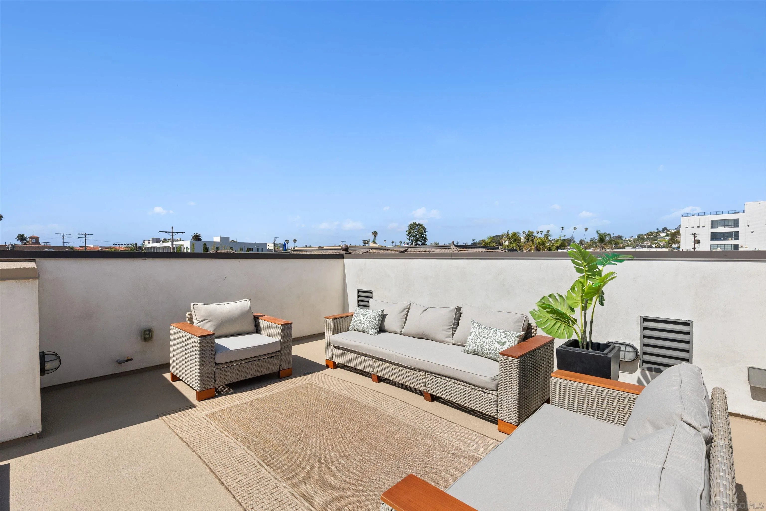 708 Silver Street La Jolla, CA 92037 - Photo 38 of 44 a view of a roof deck with couches and city view