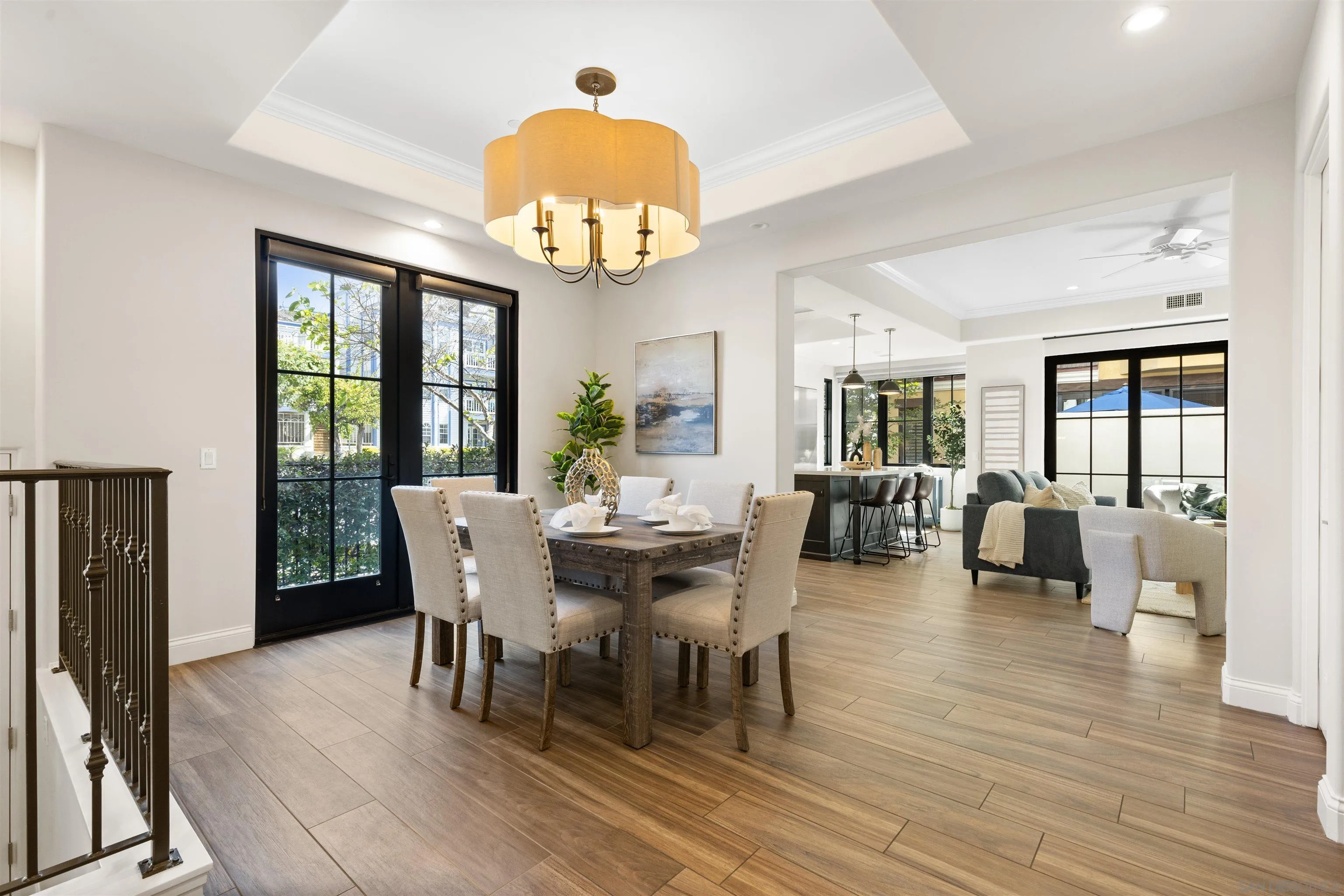 708 Silver Street La Jolla, CA 92037 - Photo 5 of 44 a view of a dining room with furniture wooden floor and chandelier