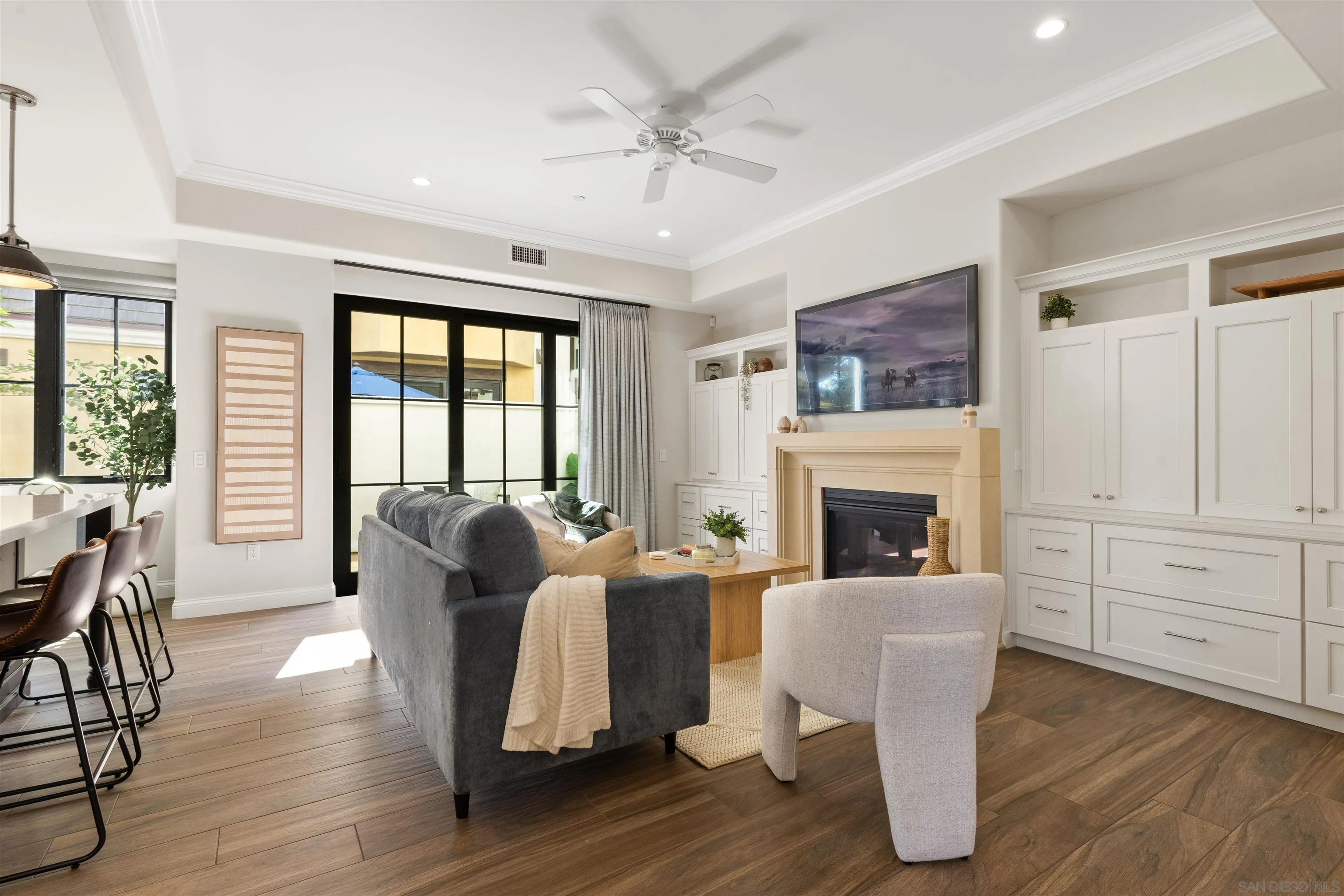 708 Silver Street La Jolla, CA 92037 - Photo 10 of 44 a living room with fireplace furniture and a large window
