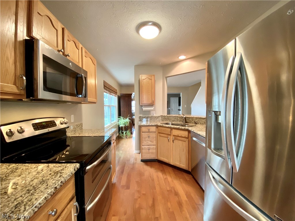 4386 Sexton Road Cleveland, OH 44105 - Photo 9 of 30 Kitchen with granite surfaces and stainless appliances