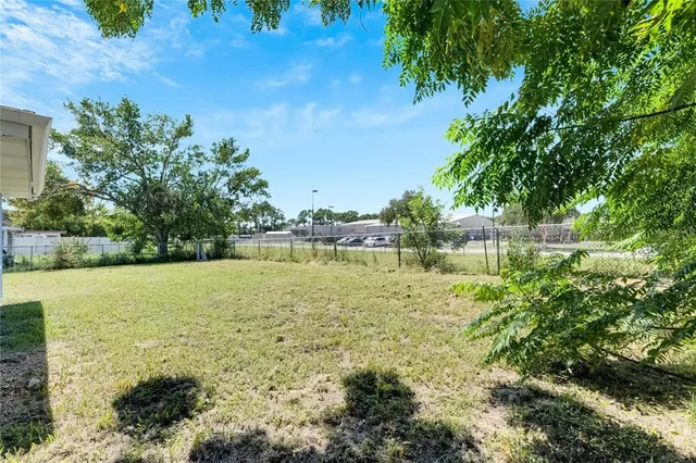 a view of a lake with a yard
