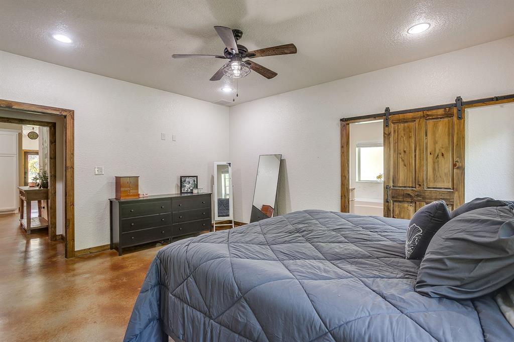 201 Curry Road Waxahachie, TX 75167 - Photo 17 of 40 a bedroom with a bed and a dresser