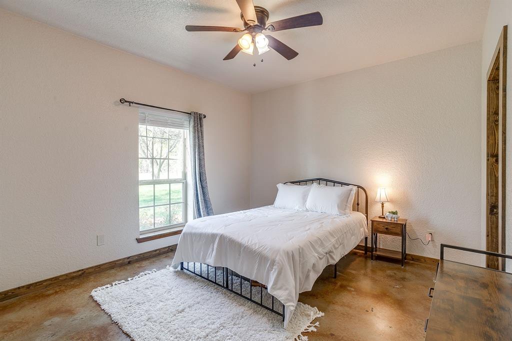 201 Curry Road Waxahachie, TX 75167 - Photo 20 of 40 a bedroom with a bed and a window