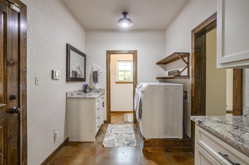 201 Curry Road Waxahachie, TX 75167 - Photo 25 of 40 a view of kitchen with stainless steel appliances granite countertop a refrigerator a stove and a sink