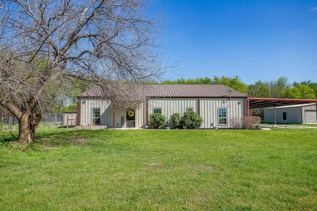 201 Curry Road Waxahachie, TX 75167 - Photo 27 of 40 a front view of a house with a garden