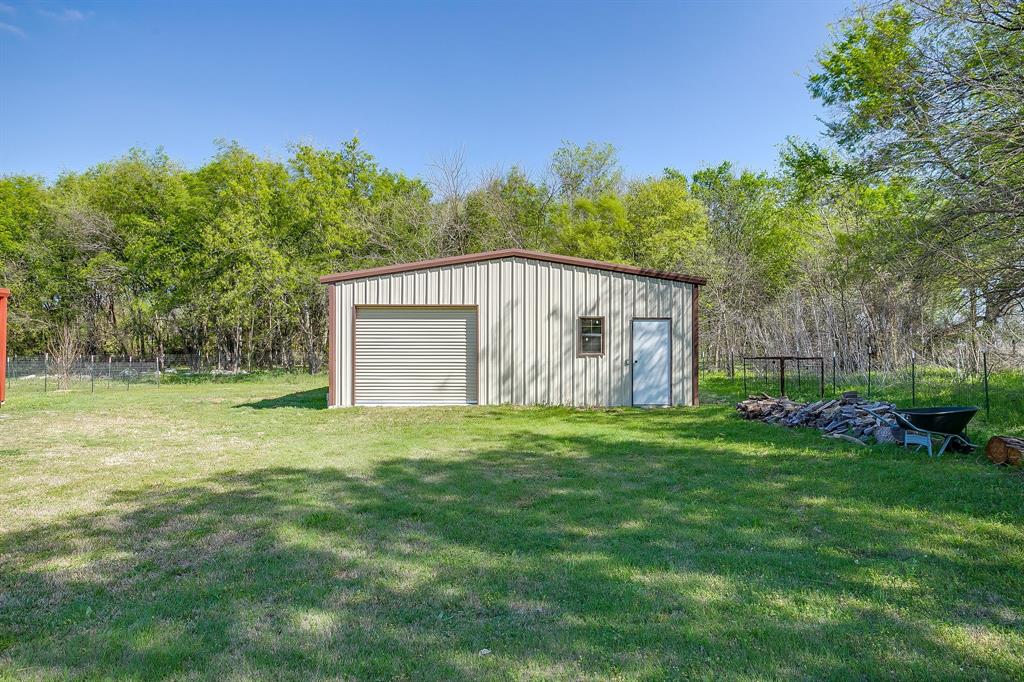 201 Curry Road Waxahachie, TX 75167 - Photo 32 of 40 a view of a house with backyard and garden