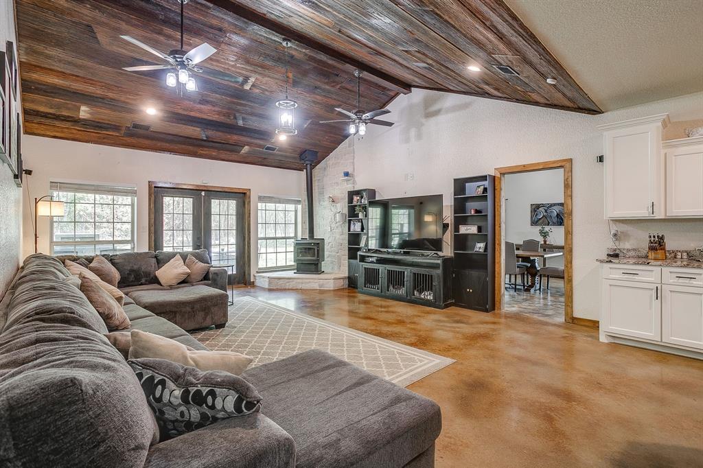 201 Curry Road Waxahachie, TX 75167 - Photo 5 of 40 a large bedroom with a large bed and a large window