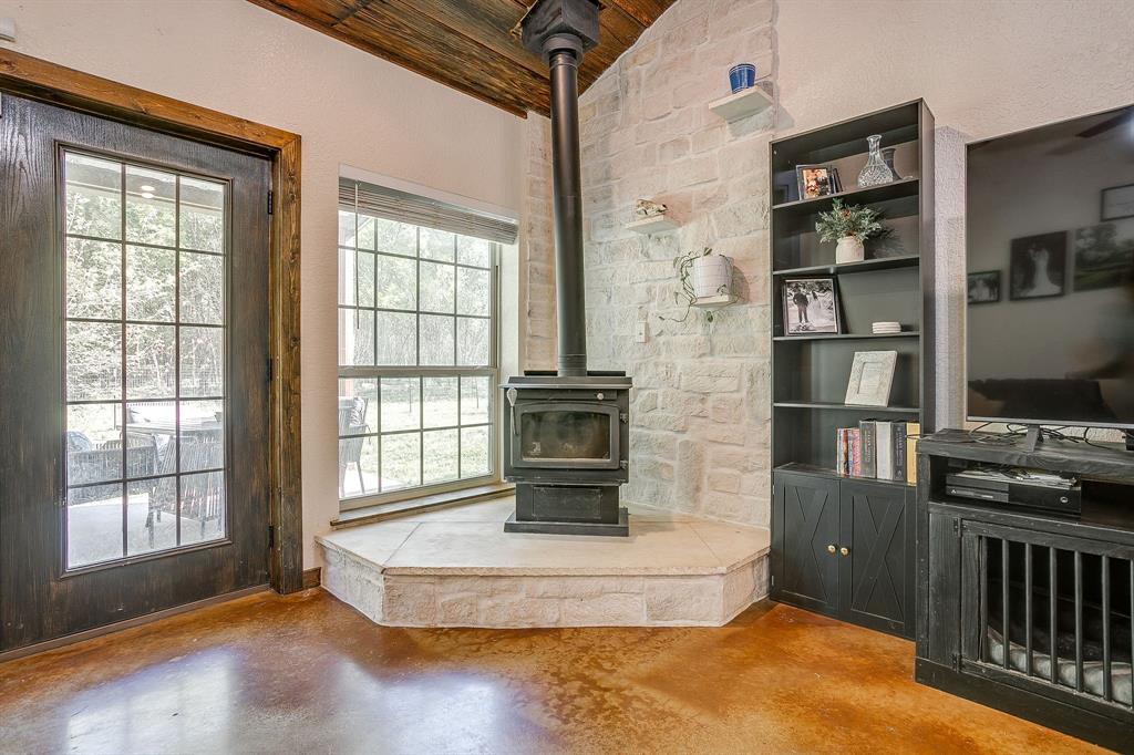 201 Curry Road Waxahachie, TX 75167 - Photo 7 of 40 a living room with fireplace furniture and a window