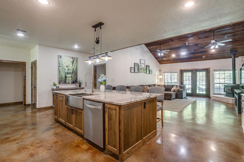 201 Curry Road Waxahachie, TX 75167 - Photo 9 of 40 a kitchen with a stove and a refrigerator