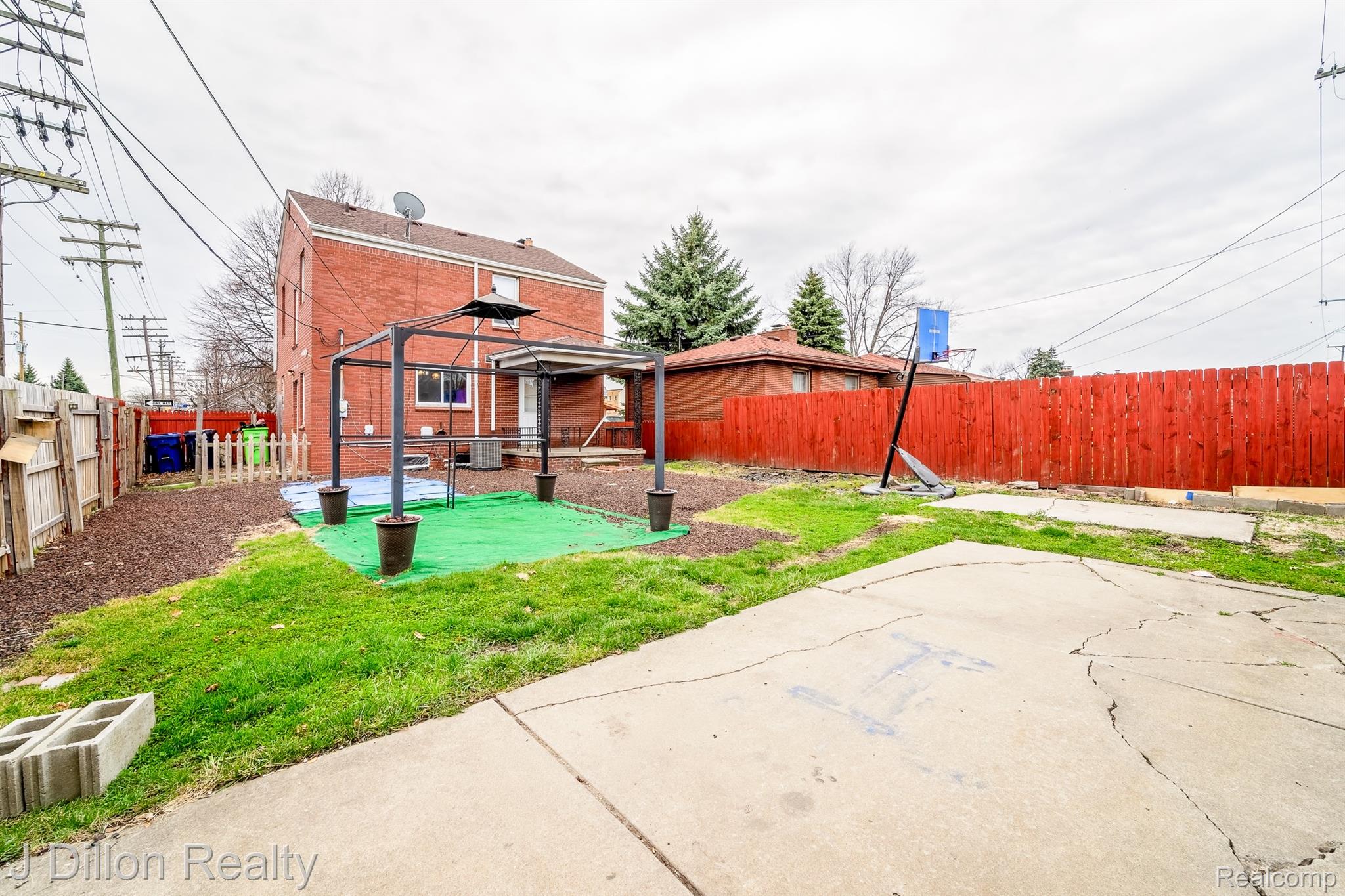 99 Chestnut Street River Rouge, MI 48218 - Photo 33 of 50 Rear view of property with a fenced backyard and a patio