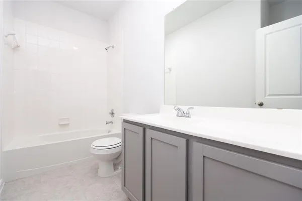 a bathroom with a sink a toilet and a bathtub