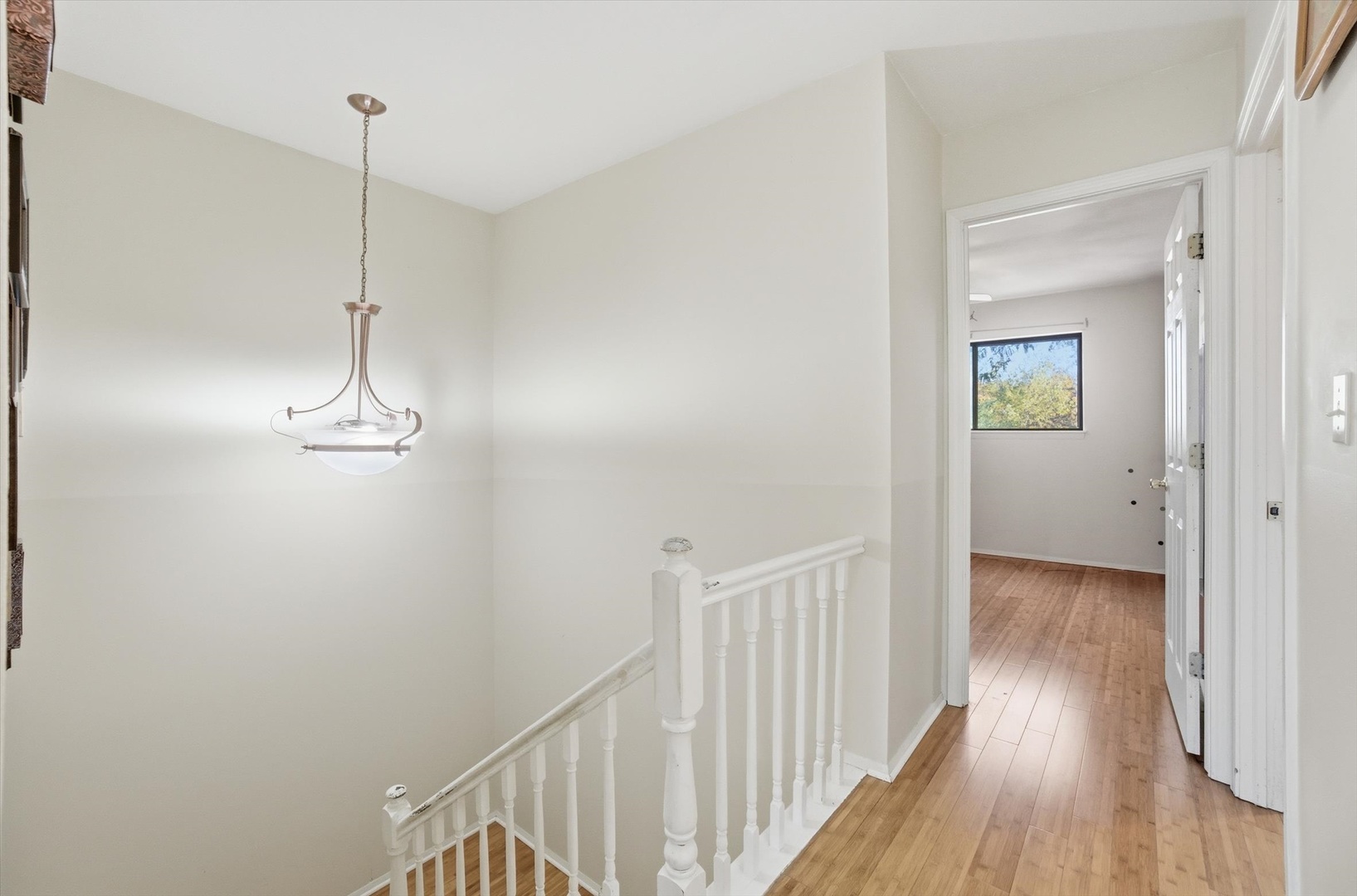 413 Buffalo Trail Wheeling, IL 60090 - Photo 16 of 29 a view of a hallway with wooden floor
