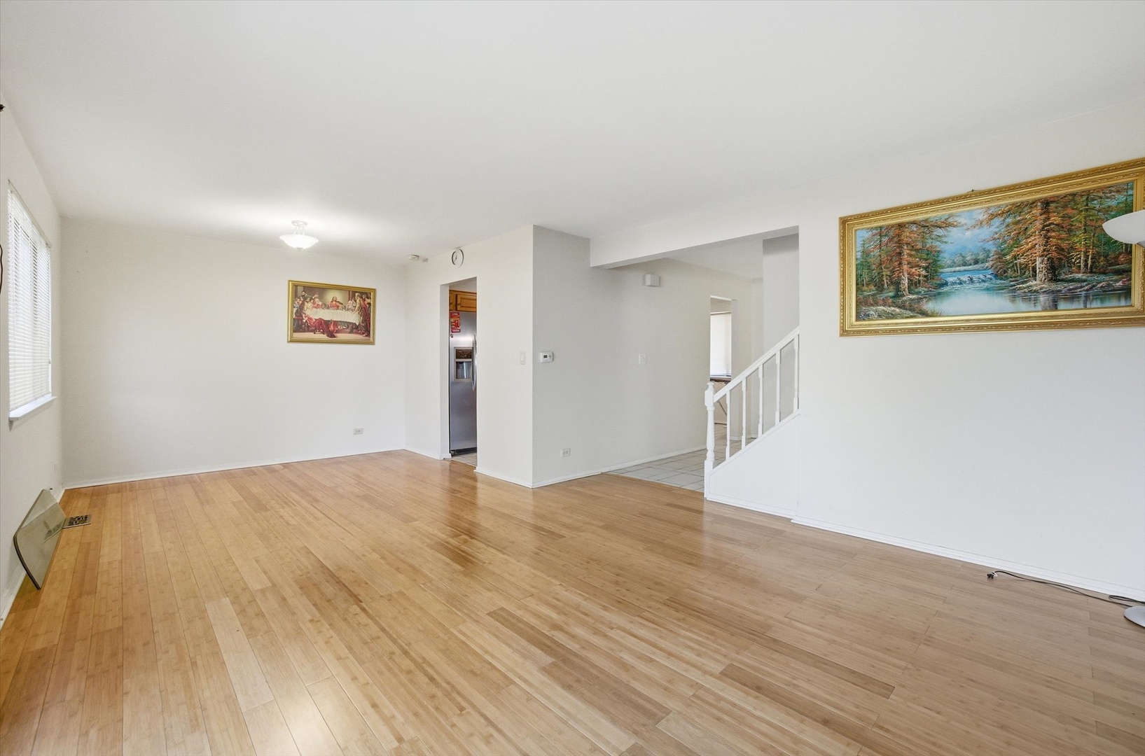 413 Buffalo Trail Wheeling, IL 60090 - Photo 7 of 29 a view of empty room with wooden floor and fan