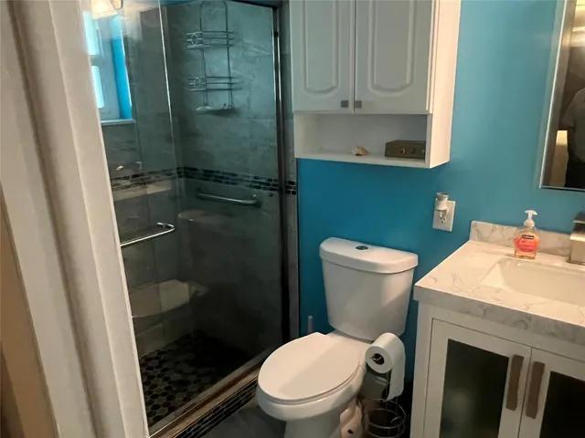 a bathroom with a toilet and a sink