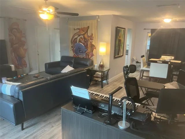 a work room with furniture and wooden floor