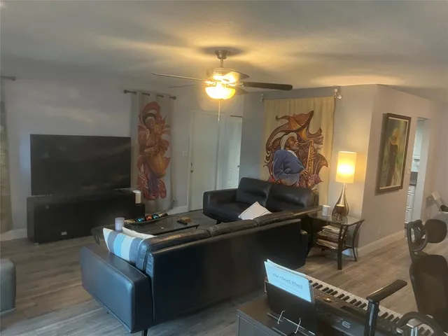 a room with furniture and a flat screen tv