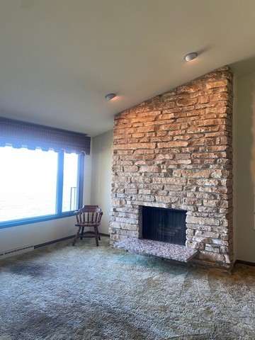 141 South Lakeshore Drive, Unit B1 Racine, WI 53403 - Photo 19 of 26 a view of empty room with fireplace and window