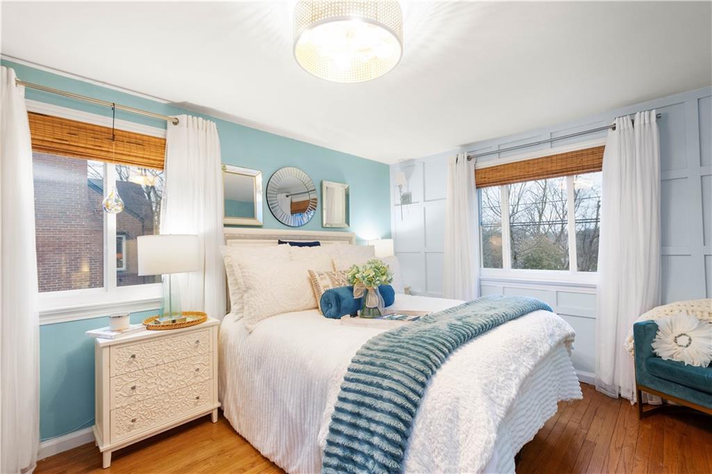 112 Locust Lane Pittsburgh, PA 15241 - Photo 14 of 38 a bedroom with a bed and wooden floor